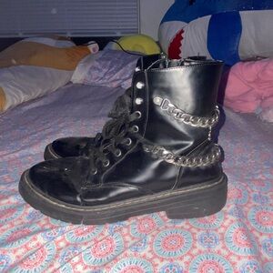 Sleek Black Combat Boots with Chain Accent